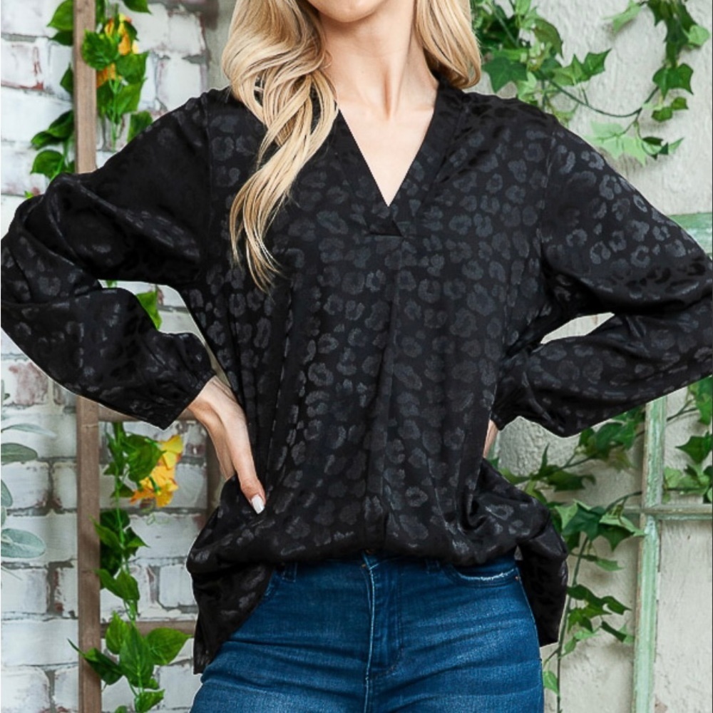 Elegant Black on black leopard print blouse.